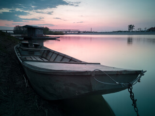 Riverbank of Sava river in Bosanski Brod, Bosnia and Herzegovina with fishing hut, moored boats...