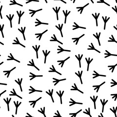 Vector seamless background with a pattern of traces of bird steps. Black white color. Fabric textile print