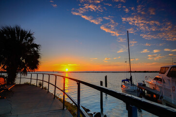 Fototapeta premium Sunrise moment at a marina in the west of Florida. Soft Focus due to Long Exposure