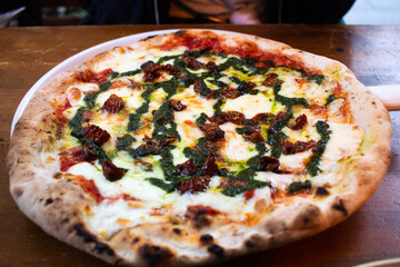 pizza with pesto drizzle