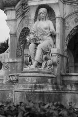 Sculpture of Roman Goddess Flora on ihe iconic landmark of Flora Fountain (Hutatma Chowk) from south Mumbai in monochrome