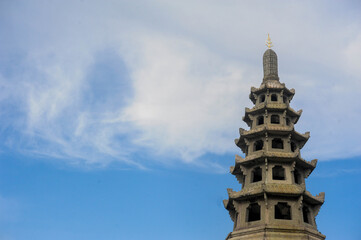 Fototapeta na wymiar Top of Buddhist Pagoda as Chinese style of Wat Kalyanamitra temple, Bangkok Thailand