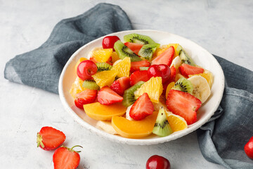 Fresh chopped fruit salad in a bowl.