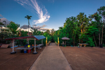 Obraz premium Background of Wat Pha Tak Suea, which is located on a mountain and offers views of neighboring countries such as Laos, the Mekong River, beautiful pagodas and churches for tourists to make merit.