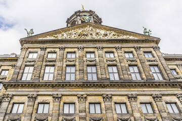 Fototapeta na wymiar Architectural fragments of Royal Palace building (Koninklijk Paleis) at the Dam Square in Amsterdam, Netherlands. Classicism style Palace built as a city hall during Dutch Golden Age (1648 - 1655).