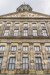 Fototapeta na wymiar Architectural fragments of Royal Palace building (Koninklijk Paleis) at the Dam Square in Amsterdam, Netherlands. Classicism style Palace built as a city hall during Dutch Golden Age (1648 - 1655).