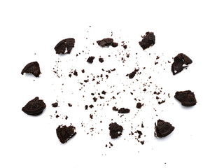 Sandwich chocolate cookies with a sweet cream with crumbs isolated on white background.