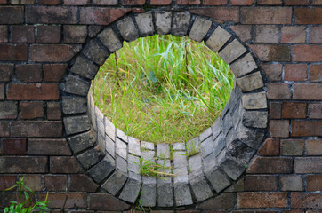 old brick wall with grass