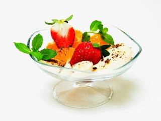 
Fruit cup with strawberries and chocolate on a white background.