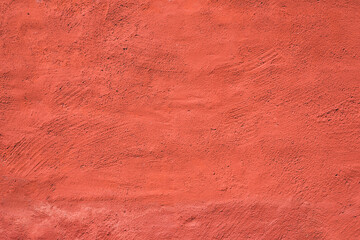 Living coral color painted wall. Perfect for texture, background.