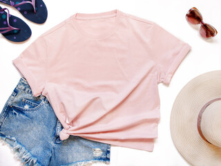 Mockup of a pink t-shirt placed between some beach accessories