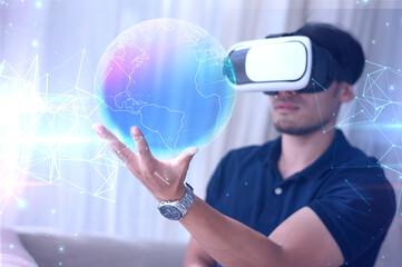 man in vr glasses, watching 360 degree video World map with virtual reality headset at home