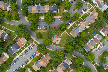 Top-down aerial view of a residential neighborhood in Rockville, Montgomery County, Maryland. The parking lots are near capacity on a weekday as people work from home during the Covid-19 pandemic. 