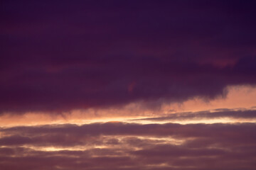 Fototapeta na wymiar Dark purple and vanilla clouds. Sunset. Beautiful natural background.