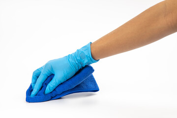 Close up of hands in rubber protective blue gloves cleaning the blue surface with a rag. Home, housekeeping concept