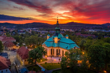 Church of the Exaltation of the Holy Cross in Jelenia Gora in Poland and the surrounding mountains...