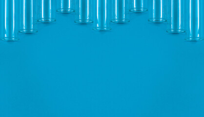 Chemical test tubes on a blue background with a blank space for your text.