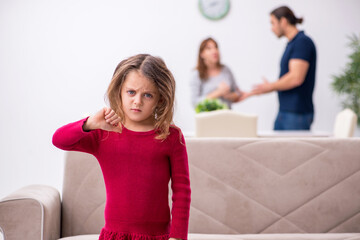 Young couple and their daughter in family conflict concept