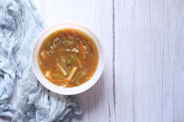  chicken vegetable soup on a black background