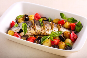 Dorado fish baked with vegetables