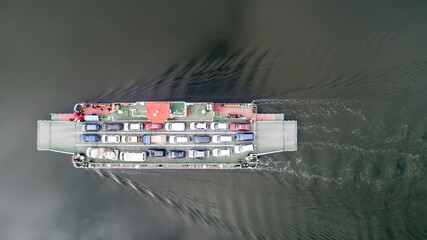 top down view of ferryboat sailing. Ferryboat transferring cars. Ferry transfers cars and passengers to the other side