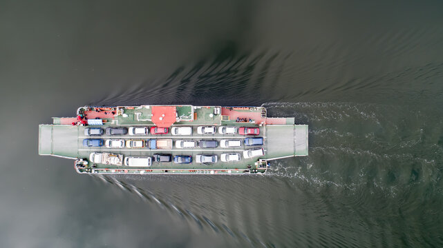 top down view of ferryboat sailing. Ferryboat transferring cars. Ferry transfers cars and passengers to the other side