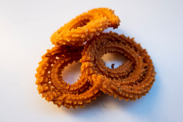 closeup view of traditional homemade muruku snacks isolated