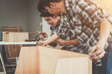 Carpenter working on wood craft at workshop to produce construction material or wooden furniture....
