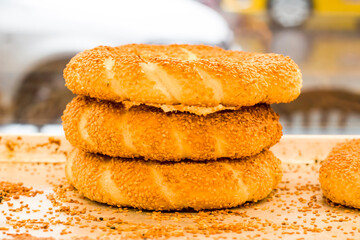 Traditional Turkish Sesame Bagel  stacked on white with sesame grains,close up