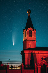 Korma Village, Dobrush District, Belarus. Comet Neowise C2020f3 In Night Starry Sky And St. John The Korma Convent Church In Korma Village. Famous Orthodox Church And Historic Heritage