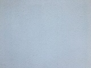 Gray concrete wall in the shadow of the sun