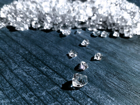Rough raw herkimer diamond (brilliant) stone mine concept. Little crystals of diamond or brilliant. Rich luxury brilliant gem light background closeup macro. Gemstone glamour valuable shine background