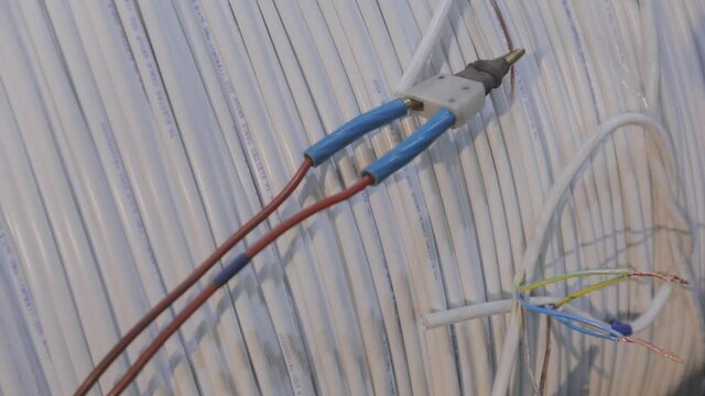 Testing wire quality in an ea factory, checking wire quality close-up.