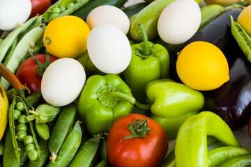 Fresh vegetables,fruits and organic white color eggs bacground,top view,flat layout.