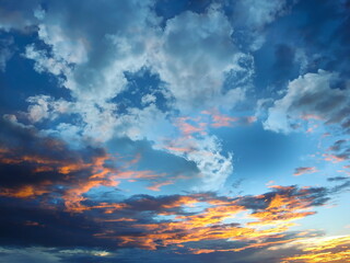 sunset blue yellow pink sky fluffy clouds and sunlight beams skyline  nature landscape weather...