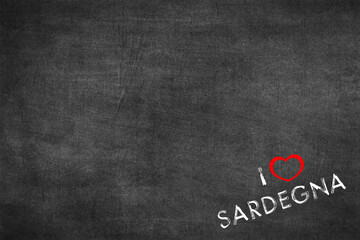Text I love Sardinia written on a blackboard