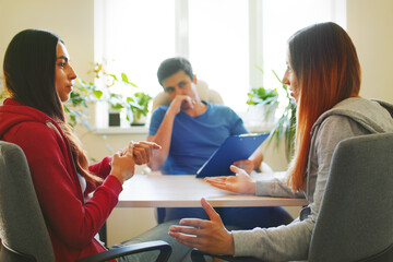 Two young women arguing on job interview