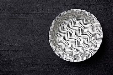 Black and white bowl on a black background