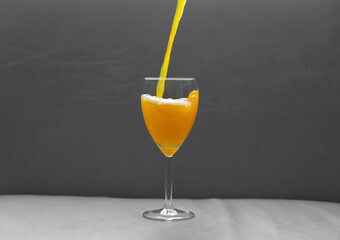 orange juice in vine glass 