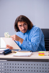 Young male teacher in the classroom