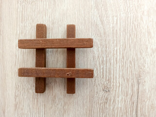 colorful wooden hashtag on wooden background