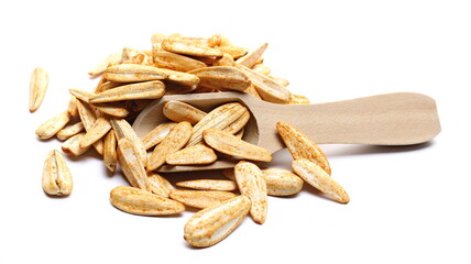 White sunflower seeds, roasted and salt with spices in wooden spoon isolated on white background
