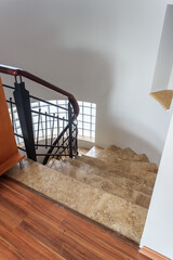 Brown marble stairs in modern house indoor.