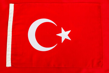 Small Turkish Flag on big size one,top view,flat layout.