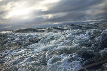 North sea under the dark clouds after the thunderstorm. A view from the sailing boat. Dramatic...