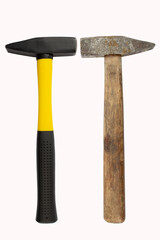 The new hammer and the old hammer are facing each other isolated on white background. New generation vs. old generation.Tools for carpentry. Images for design.