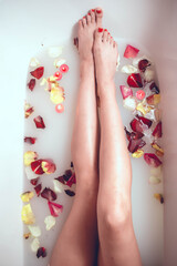 feet and rose petals