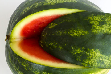 Sweet and a slice of cut watermelon on white background with knife