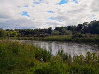 Clouds over the river in Aberdeen, Scotland on a summer day.