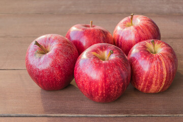 red apples on wooden table